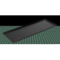Taca cukiernicza 60x20 cm czarna - widok z góry pod kątem na zielonym tle