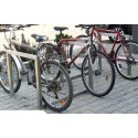 Stojak rowerowy Irys III - stojak ze stali nierdzewnej z trzema rowerami na kostce brukowej