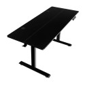Biurko elektryczne 140x60 cm czarne - widok z góry pod kątem, blat z przepustami na kable